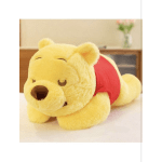 Yellow plush bear wearing a red shirt