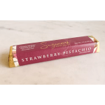 Strawberry pistachio chocolate bar in pink and gold wrapper