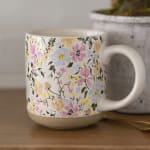 Floral-patterned ceramic mug with a large handle