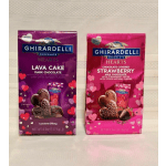 Two Ghirardelli chocolate heart gift bags in purple and pink packaging