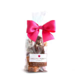 Bag of assorted caramels tied with a bright pink bow