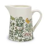 White ceramic pitcher with a floral and insect pattern