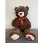 Large brown teddy bear with a red ribbon