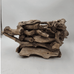Stacked driftwood planter with small moss accents