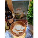 Gift display with a flower card, wine bottle, cookies, and a potted plant