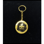 Gold keychain with a round black-and-gold memorial charm