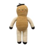 Knitted stuffed doll with a tan body and cream arms and legs