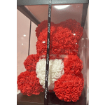 Red and white rose teddy bear in a clear gift box with a ribbon