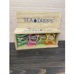 Wooden tea gift box holding four assorted tea packets