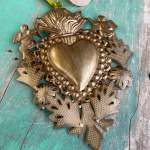 Gold heart-shaped wall ornament with angel figures and decorative leaves