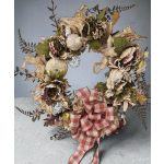 Dried floral wreath with a red plaid bow