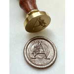 Two wax seal stamps with an engraved letter A and leaf design