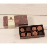 Box of assorted chocolates with the lid beside it