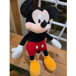 Plush Mickey Mouse toy in red shorts and yellow shoes