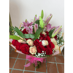 Bouquet of red and blush roses with pink lilies and baby's breath