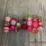Decorative heart-topped picks with colorful beaded and patterned spheres