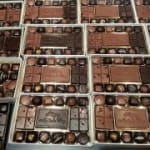 Assorted boxed chocolates arranged in compartments