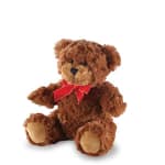 Brown teddy bear with a red bow sitting on a white background