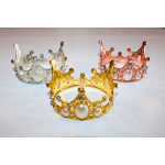 Four jeweled crown-shaped tiaras in gold, silver, rose gold, and pearl tones