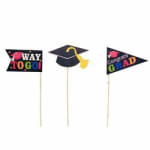 Three graduation pick decorations with colorful text and a mortarboard cap.