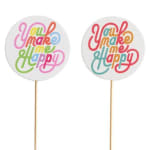 Two round cake toppers with colorful "You make me happy" text