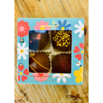 Box of four decorated chocolates in a floral spring-themed package