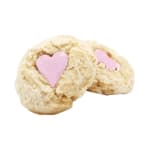 Two heart-decorated cookies on a white background