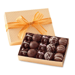 Box of assorted chocolates with a gold ribbon