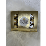 Box of Ferrero Rocher chocolates on a white fur surface