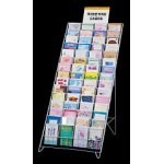 Wire rack display of assorted greeting cards on a black background