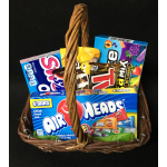Basket filled with assorted candy boxes and bars