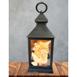 Black lantern with a cross and white doves inside