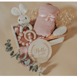 New baby gift box with a crocheted bunny, pink blanket, and Hello World sign