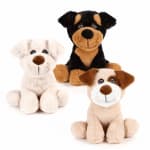 Three plush dog toys in black, white, and tan sit on a white background.