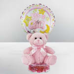 Pink teddy bear with a "It's a Girl" balloon