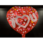 Heart-shaped red foil balloon with hearts and the word "love"