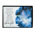 Decorative gift box with a star ornament and inspirational text