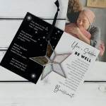 Star-shaped hanging ornament with two greeting cards on a white surface
