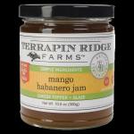 Jar of mango habanero jam with a black lid