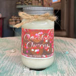 Jar candle labeled Chocolate Cherry with a twine bow