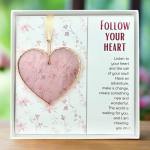 Decorative heart ornament in a gift box with an inspirational quote card
