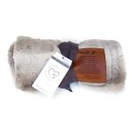 Folded gray faux-fur blanket with a ribbon and message tags