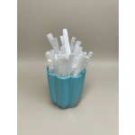 Blue cup holding white crystal-like sticks