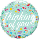 Round mint-green balloon with floral print and the words "Thinking of you"