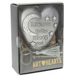 Gift box with a decorative heart plaque reading "Love you to the moon and back"