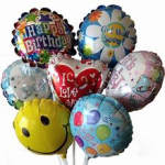 Cluster of birthday and love-themed foil balloons