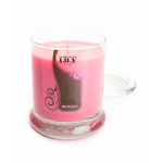 Pink candle in a clear glass jar with a label reading Stargazer Lily