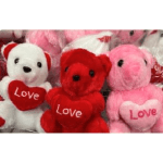 Plush teddy bears in pink, red, and white holding heart pillows with "Love"