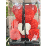 Red rose teddy bear with a white heart in a clear display box