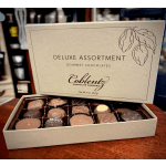 Open box of assorted gourmet chocolates on a table
